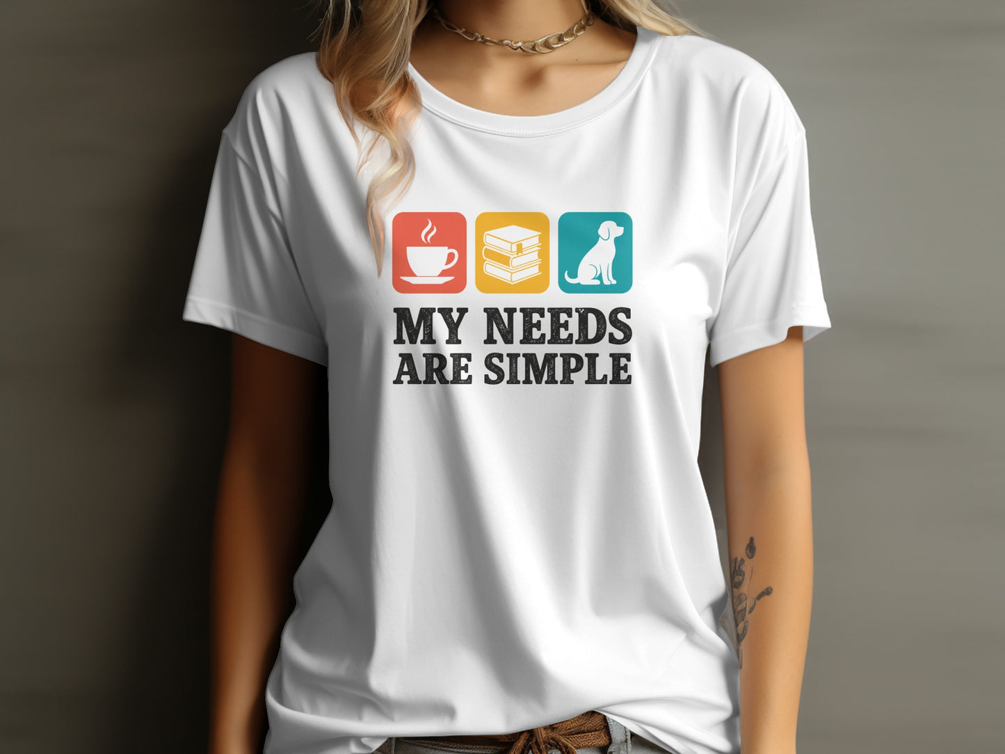 White t-shirt graphic with coffee, books, and dog icons, and text "MY NEEDS ARE SIMPLE".