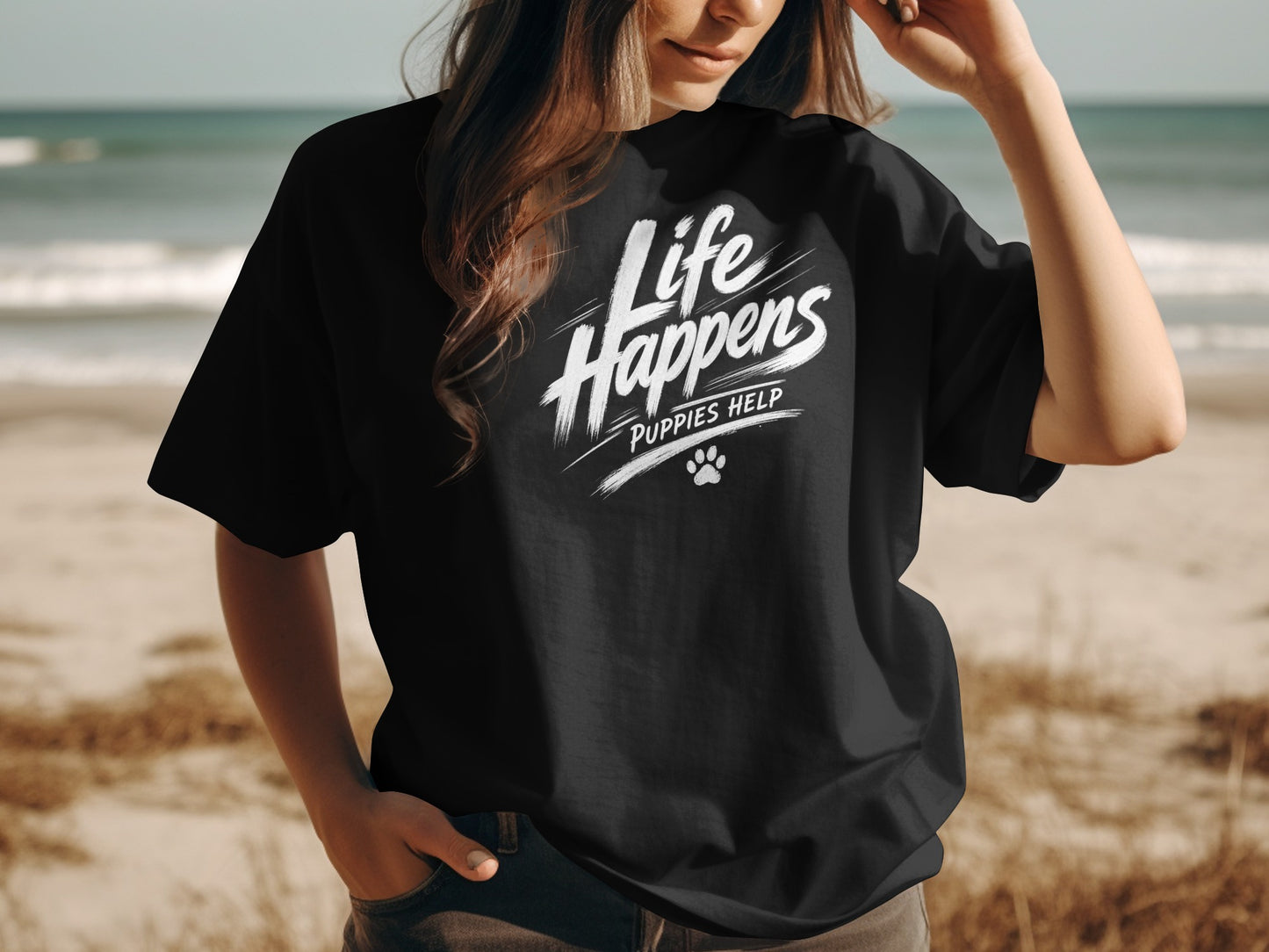 Black t-shirt with "Life Happens Puppies Help" text and paw print logo.