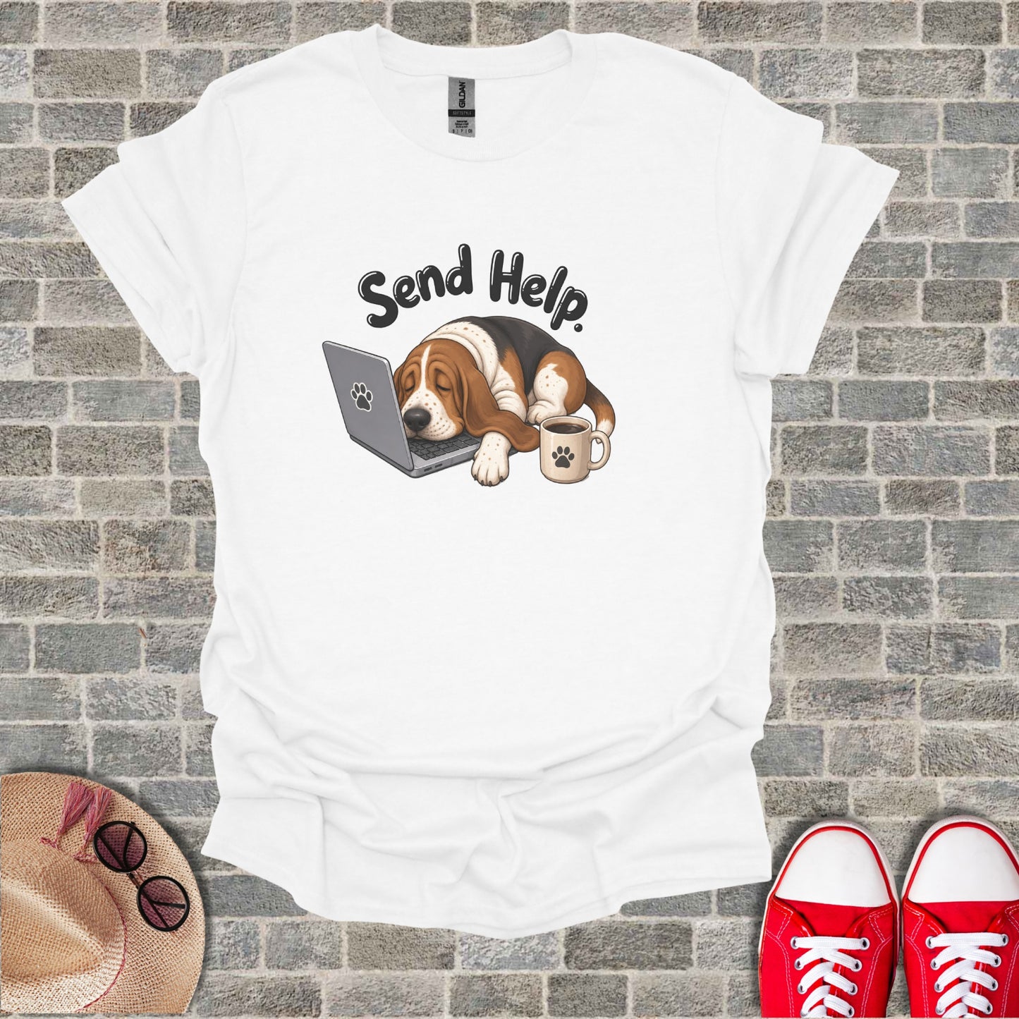 Basset Hound rests on laptop with "Send Help" text and coffee mug.