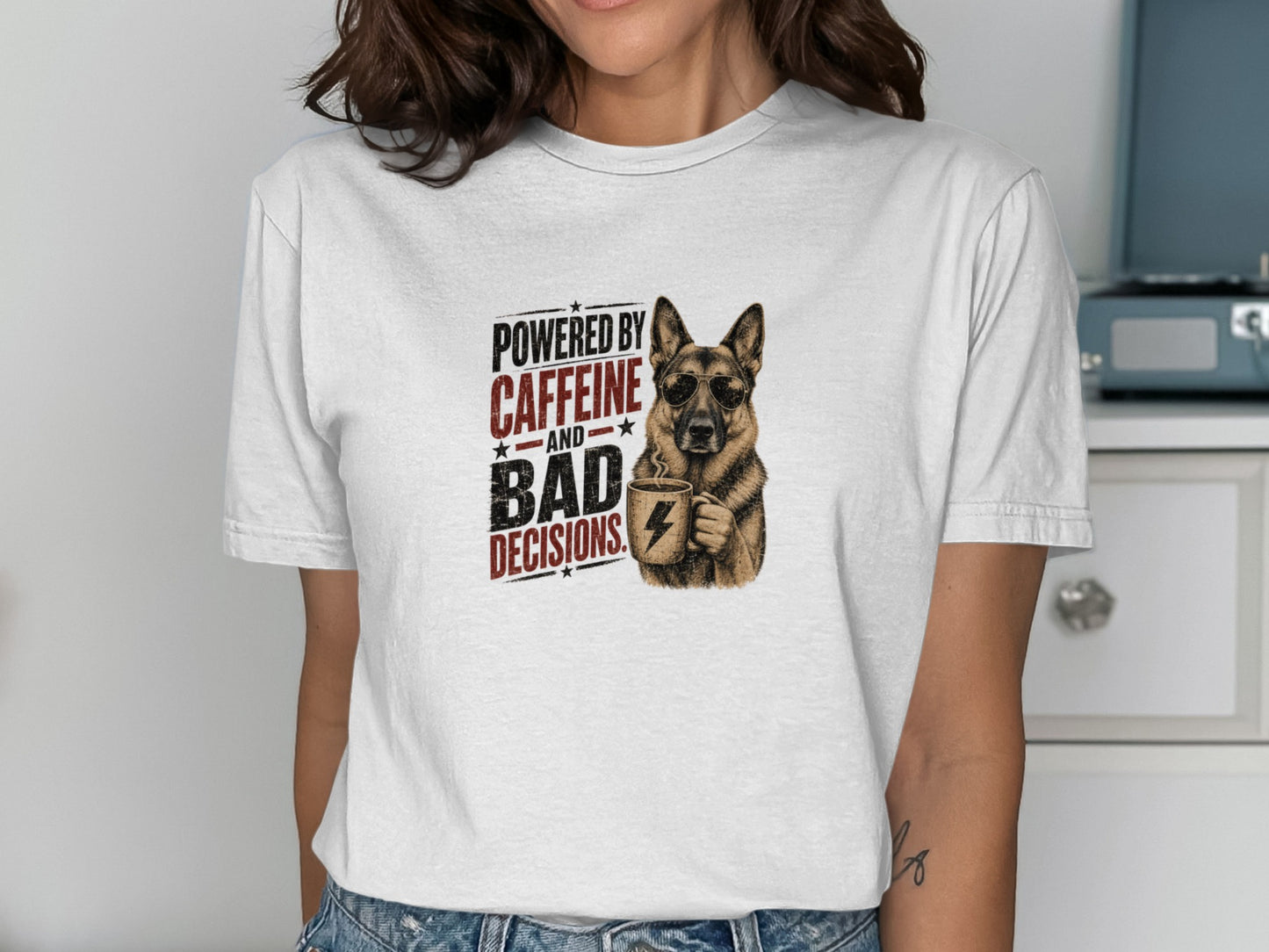German Shepherd wearing sunglasses holding coffee mug, "Powered by Caffeine and Bad Decisions" text.