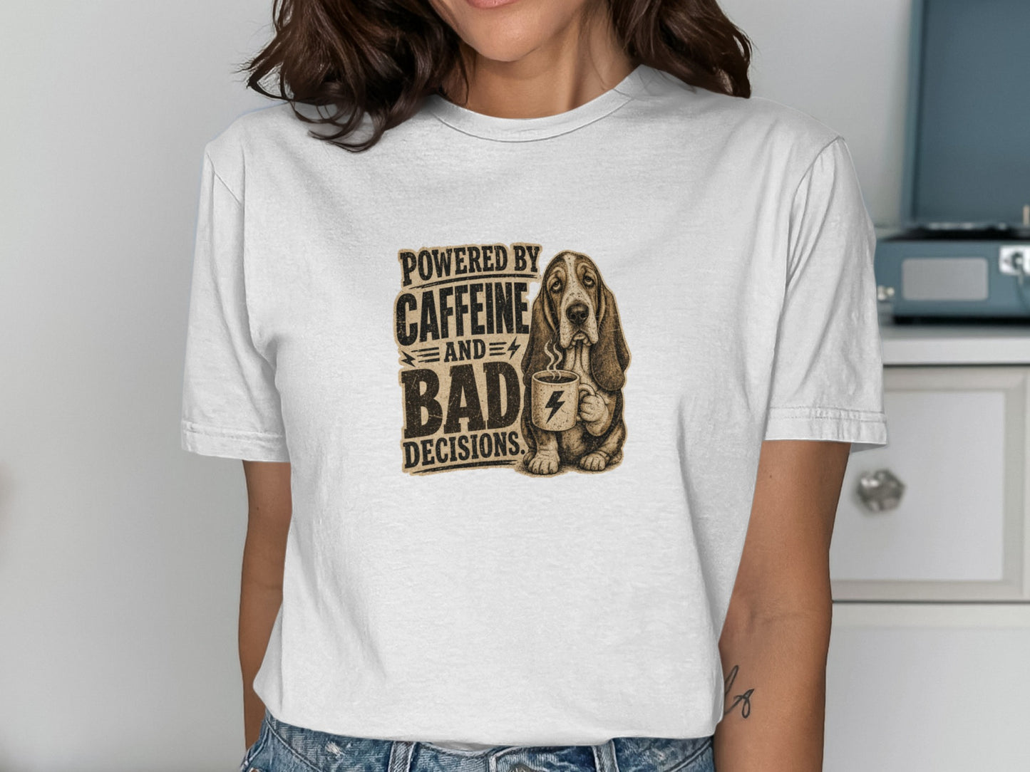 T-shirt with "Powered by Caffeine and Bad Decisions" text and Basset Hound holding coffee.