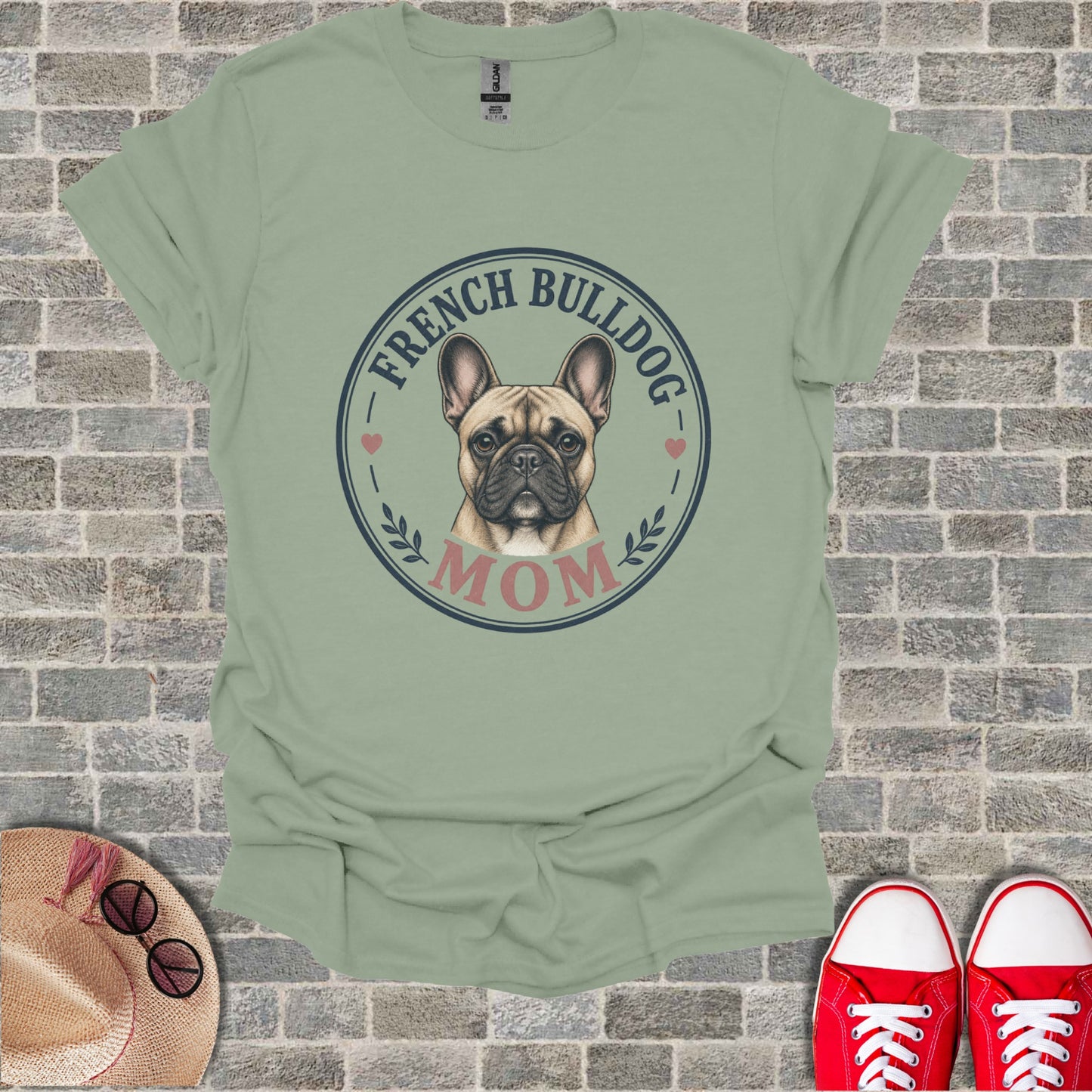 French Bulldog Mom graphic on a light green t-shirt with brick background.