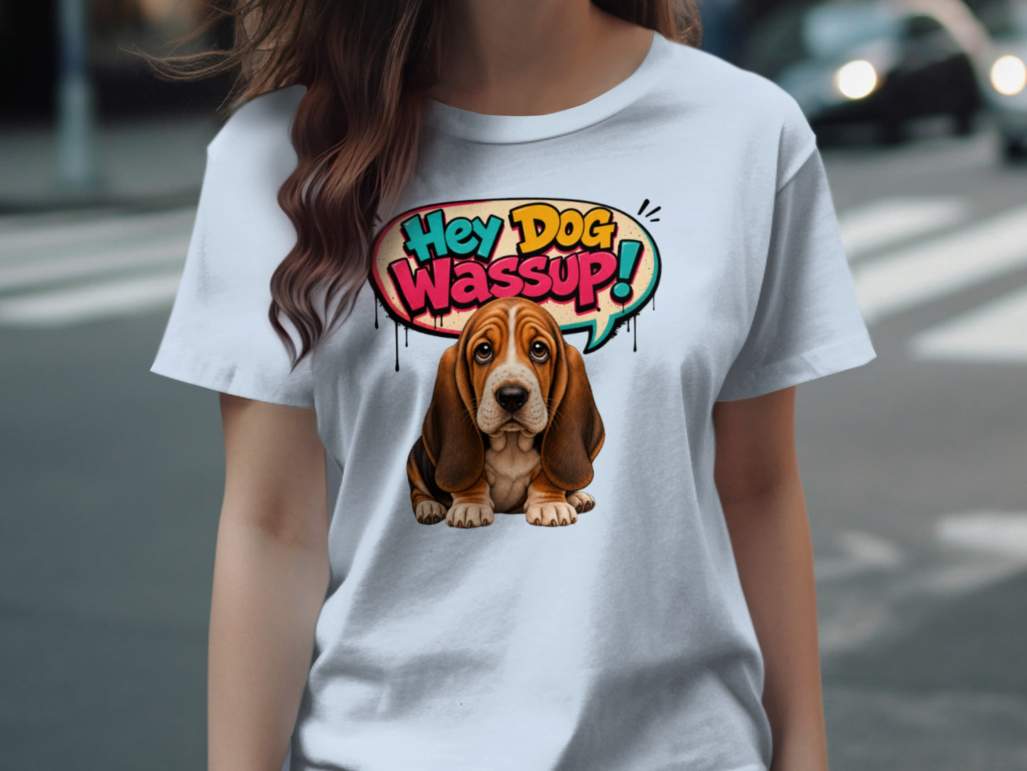 Basset hound with "Hey Dog Wassup!" speech bubble on a light blue t-shirt.