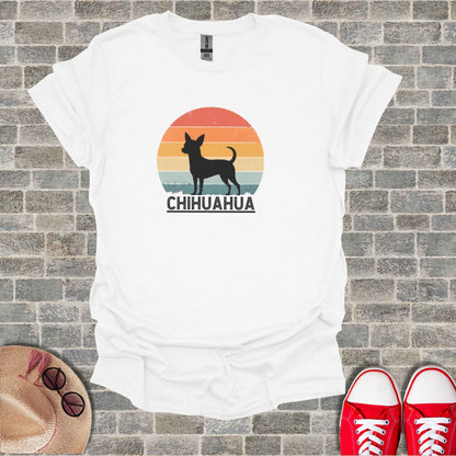 White t-shirt with black chihuahua silhouette and "CHIHUAHUA" text against a sunset.
