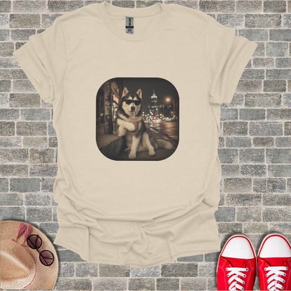T-shirt with graphic of husky dog wearing sunglasses drinking from a cup.