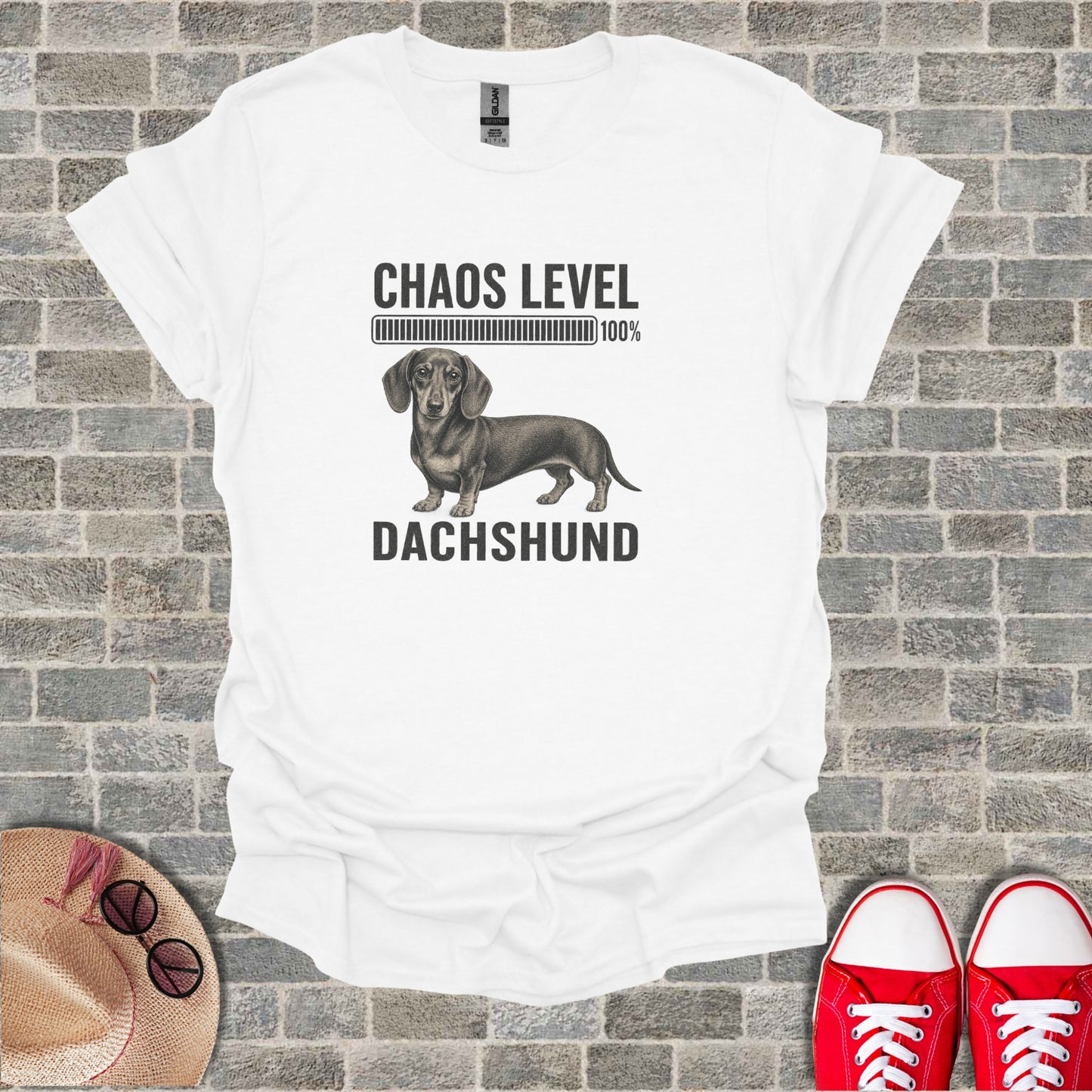White t-shirt with dachshund, "Chaos Level 100%" text.