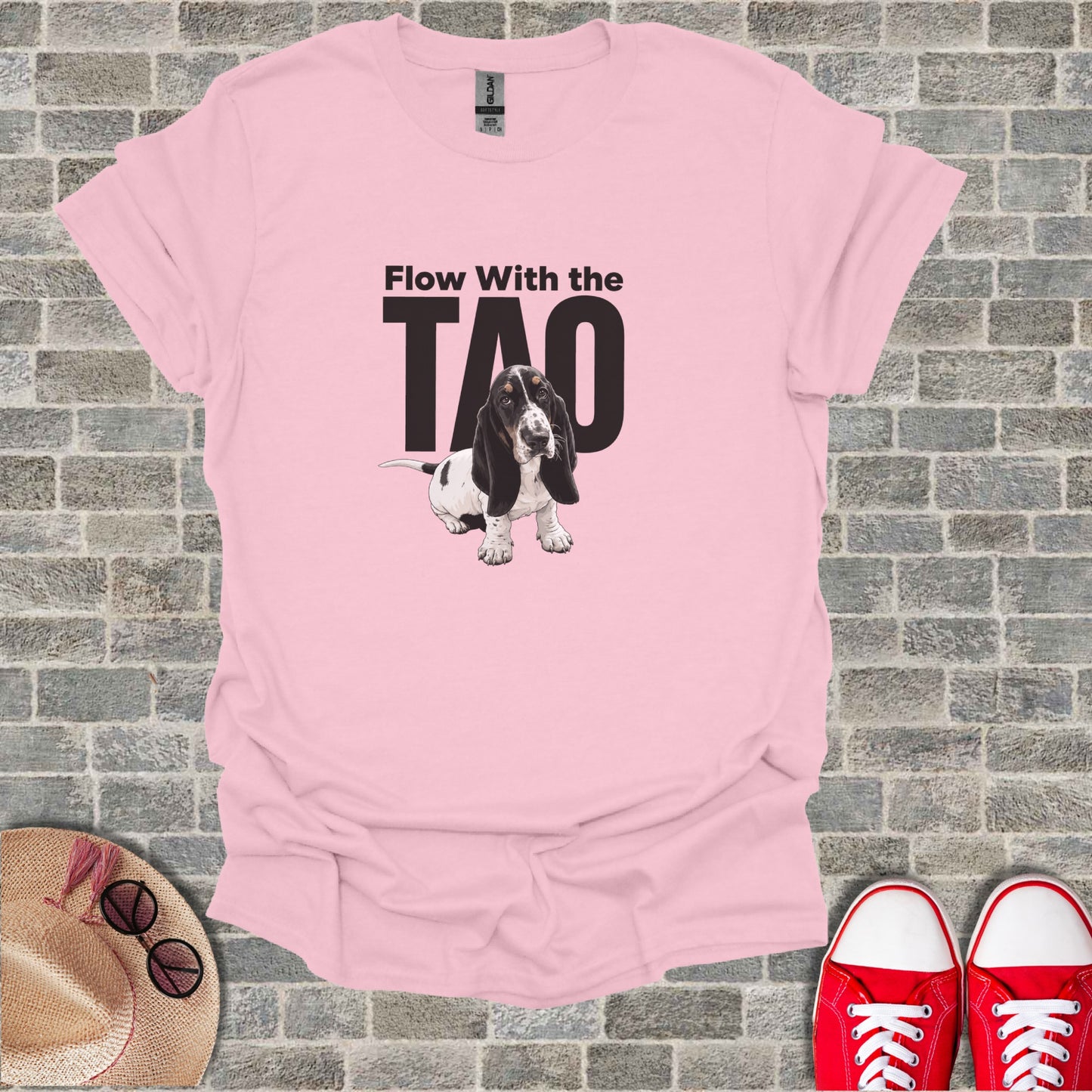 Pink t-shirt with "Flow With The Tao" and a basset hound graphic.