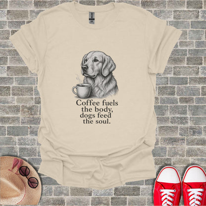 Cream t-shirt with sketch of golden retriever and coffee cup; text reads "Coffee fuels the body, dogs feed the soul."