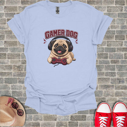 Light blue t-shirt with cartoon pug wearing headphones and holding a video game controller.