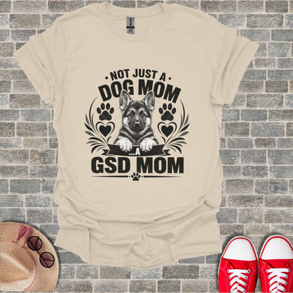 Cream t-shirt with black text and German Shepherd puppy graphic.
