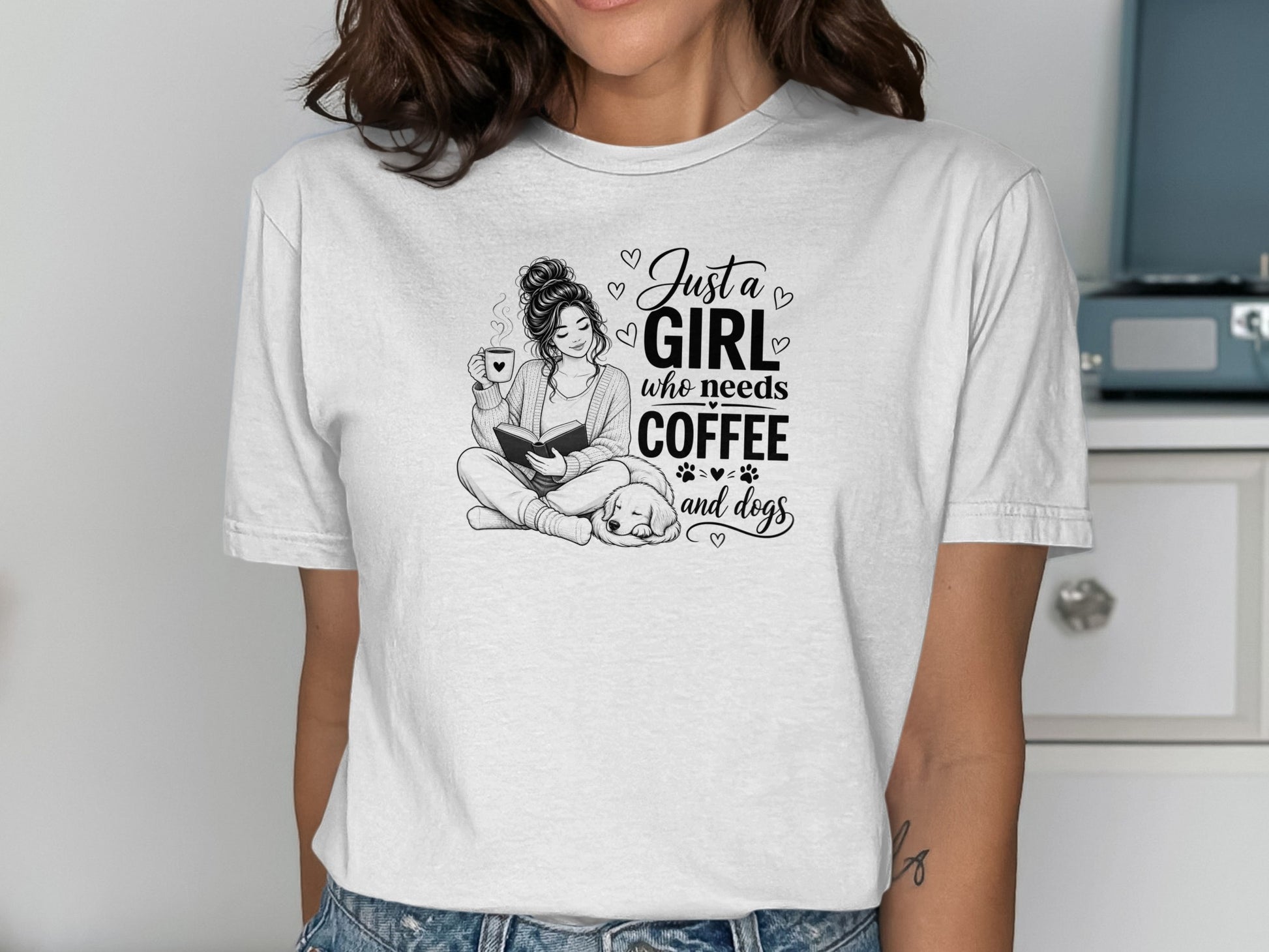 T-shirt with "Just a girl who needs coffee and dogs" text and illustration.