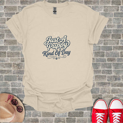 Cream t-shirt with "Just A Puppy Kind Of Day" text and paw prints.