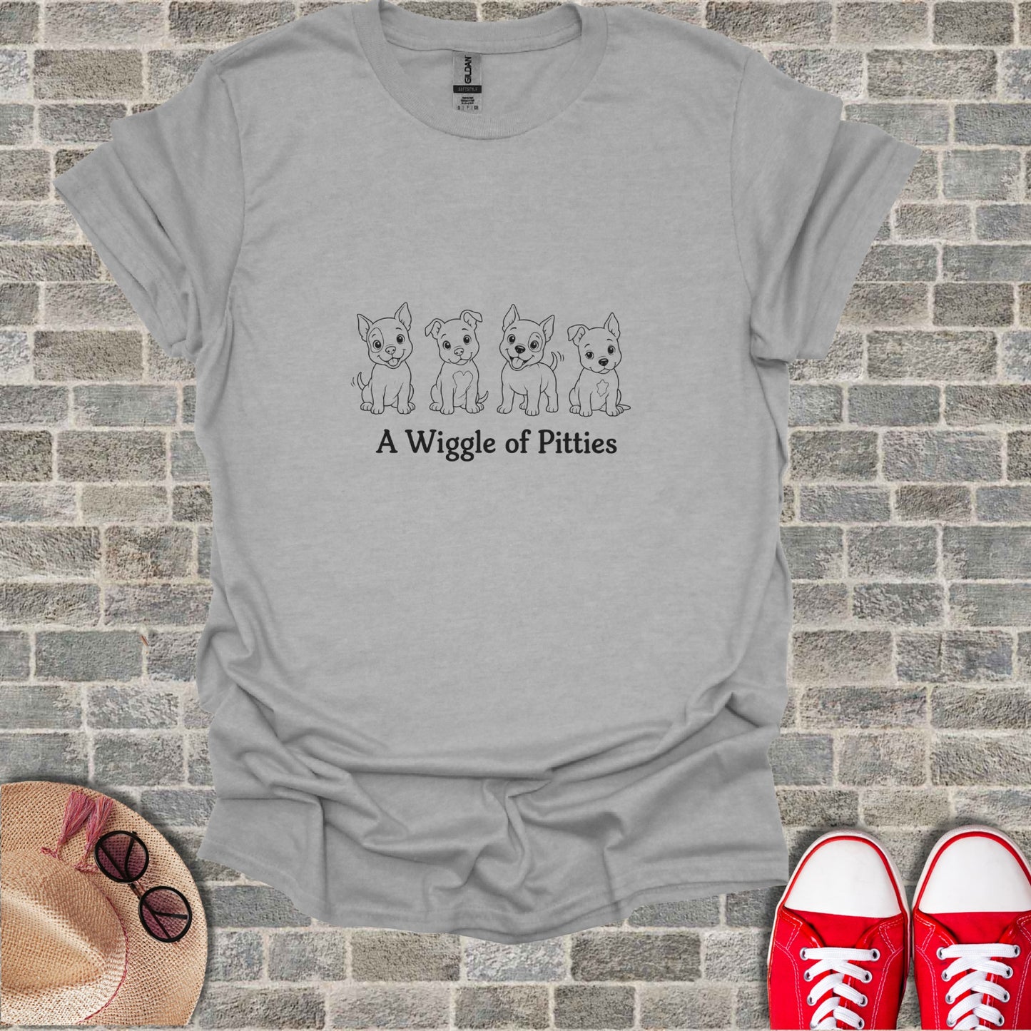 Grey t-shirt with "A Wiggle of Pitties" and four cartoon pitbull puppies.