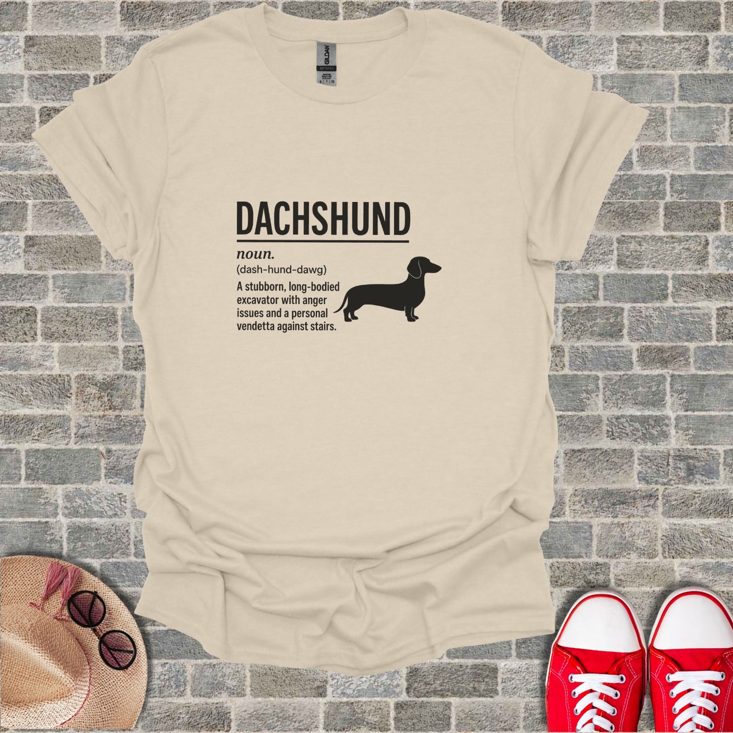 Cream t-shirt with black dachshund silhouette and definition.