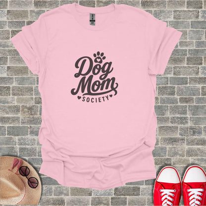 Pink t-shirt with "Dog Mom Society" text and small heart accent.