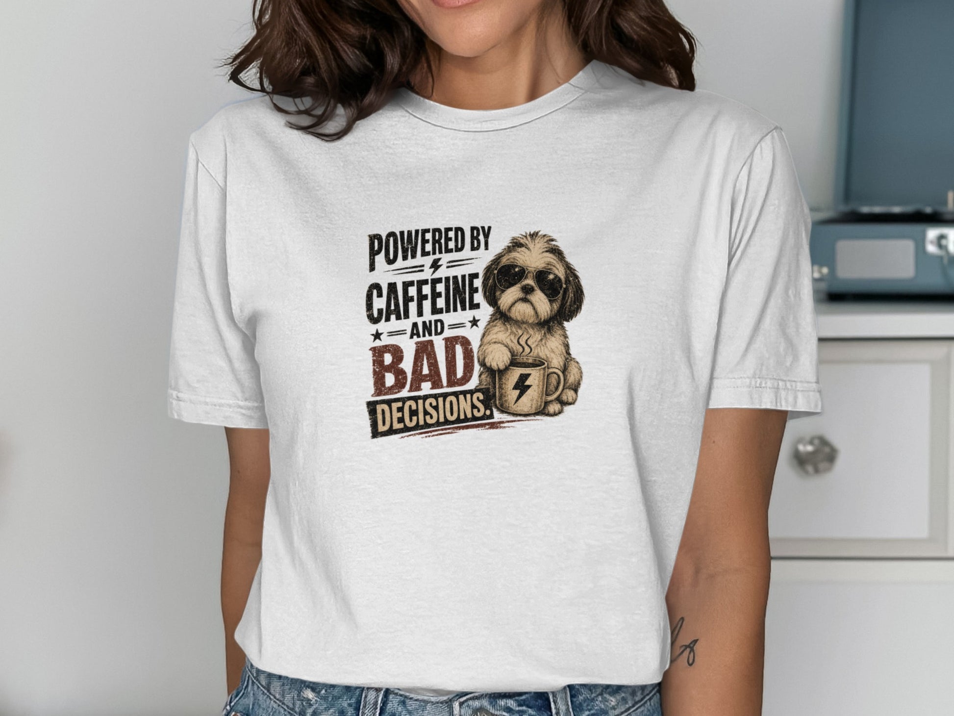 Shih Tzu wearing sunglasses holding coffee cup, text says "Powered by caffeine and bad decisions".