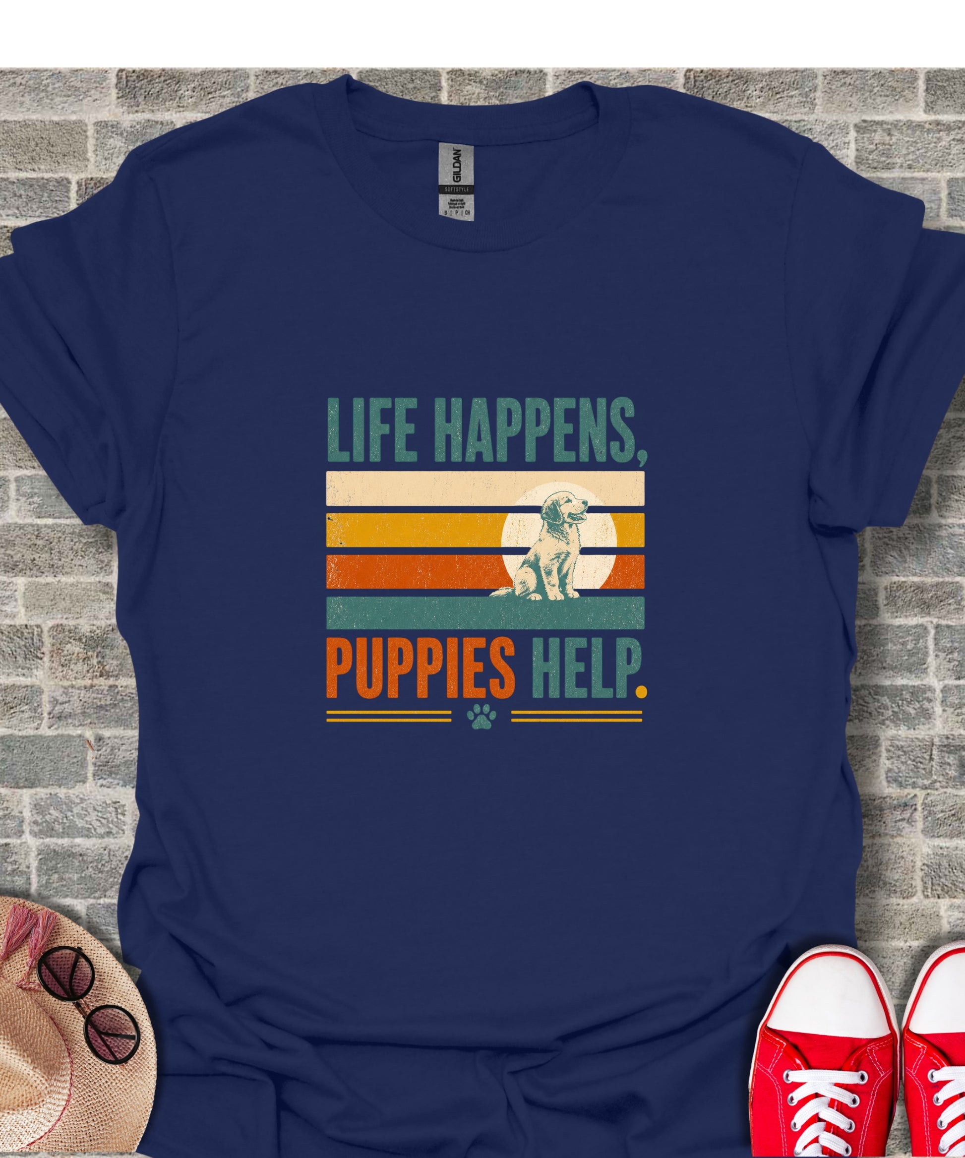 Navy t-shirt with sunset graphic and text "Life Happens, Puppies Help."