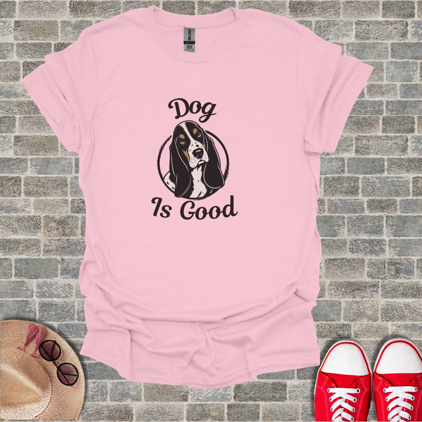 Pink t-shirt with a black, white, and tan dog in a circle, text reads "Dog Is Good".