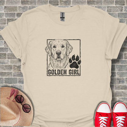 Cream t-shirt with Golden Retriever and paw print graphic.