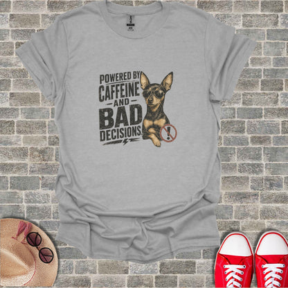Grey t-shirt with graphic of a chihuahua wearing sunglasses and text "Powered by Caffeine and Bad Decisions".