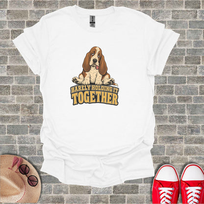 White t-shirt with a Basset Hound graphic and "Barely Holding It Together" text.