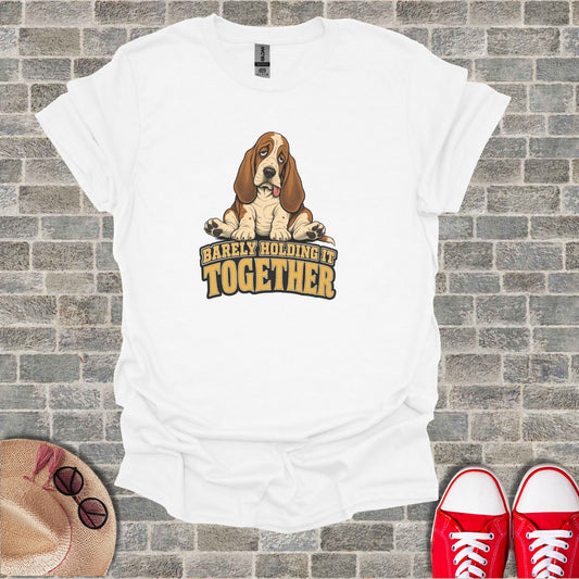 White t-shirt with a Basset Hound graphic and "Barely Holding It Together" text.