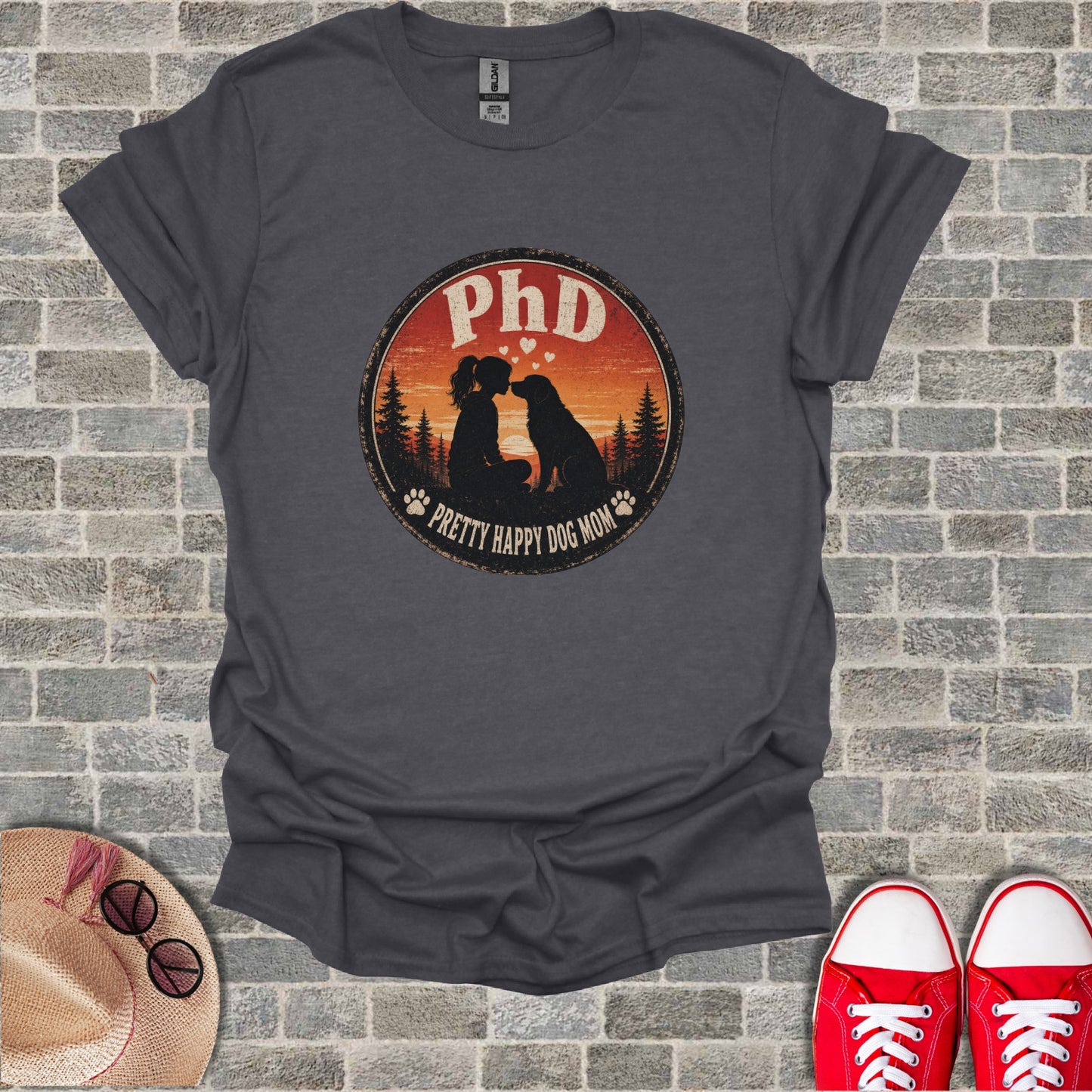 T-shirt with "PhD Pretty Happy Dog Mom" circular graphic featuring dog and child.