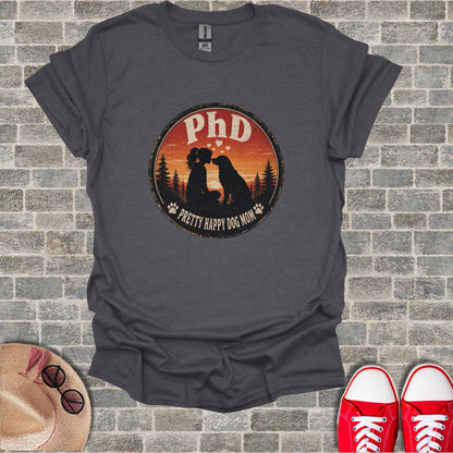 T-shirt with "PhD Pretty Happy Dog Mom" circular graphic featuring dog and child.