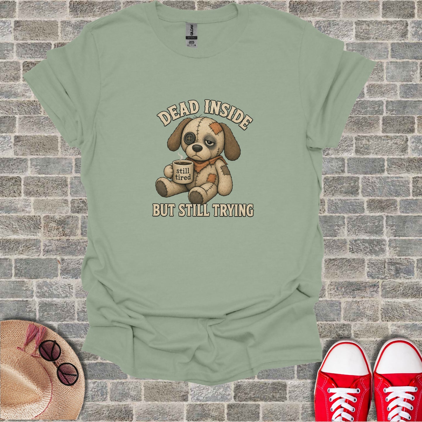 T-shirt with cartoon dog saying "DEAD INSIDE BUT STILL TRYING" and "still tired".
