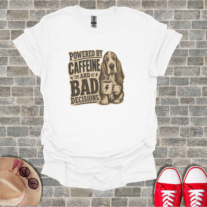 White t-shirt with sketch of Basset Hound holding coffee cup, text "Powered by Caffeine and Bad Decisions".