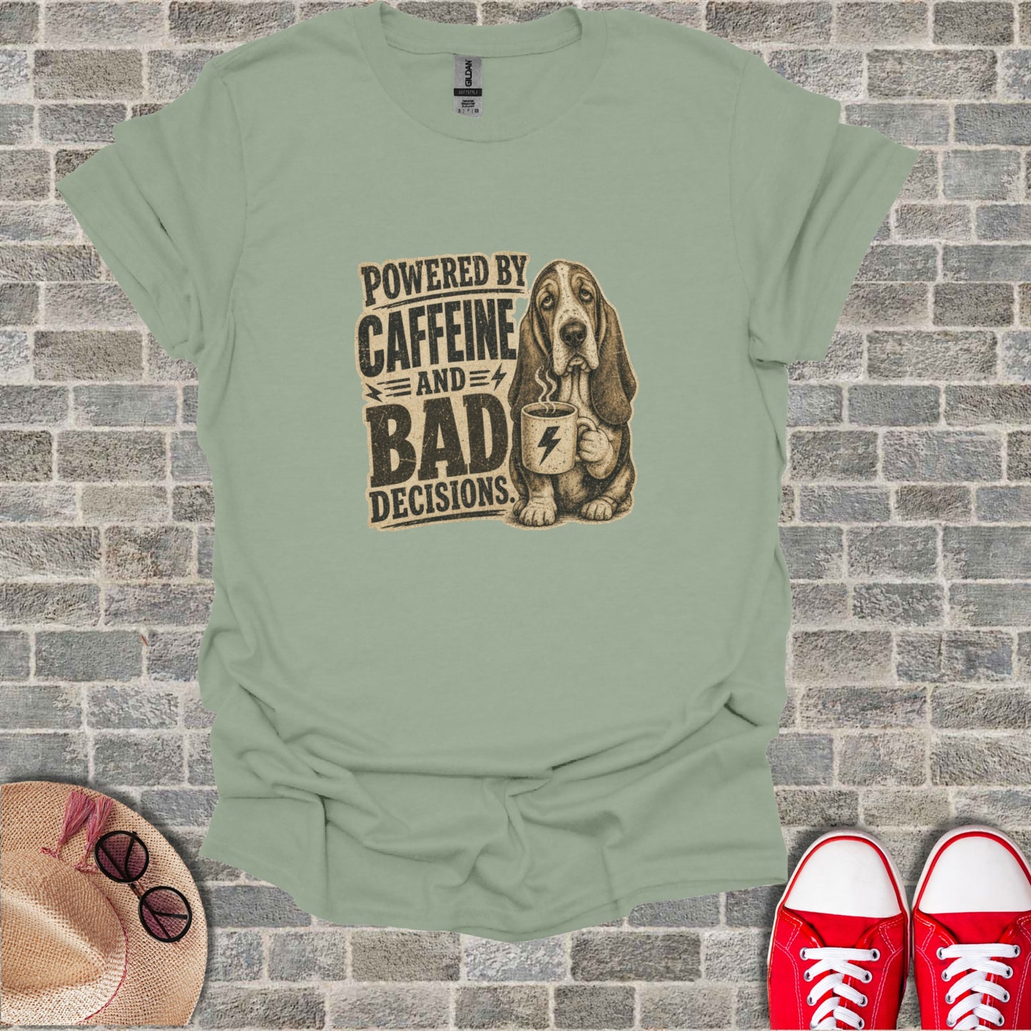 T-shirt with a basset hound holding a coffee mug, text "Powered by Caffeine and Bad Decisions".