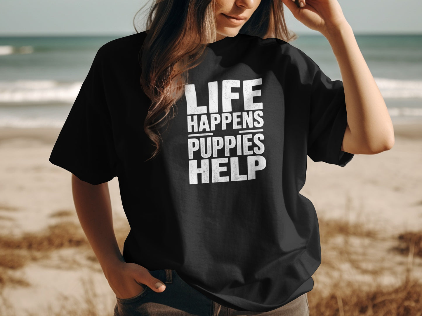 Black t-shirt with white text "LIFE HAPPENS PUPPIES HELP".