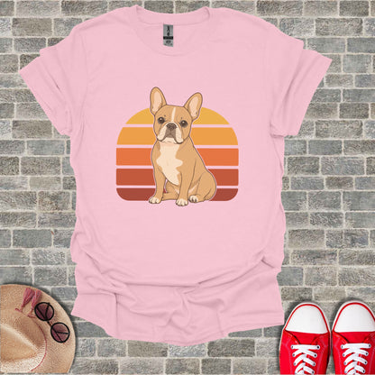 Pink t-shirt with a French bulldog and retro sunset graphic.