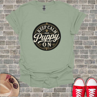Light green t-shirt with "Keep Calm and Puppy On" text design.