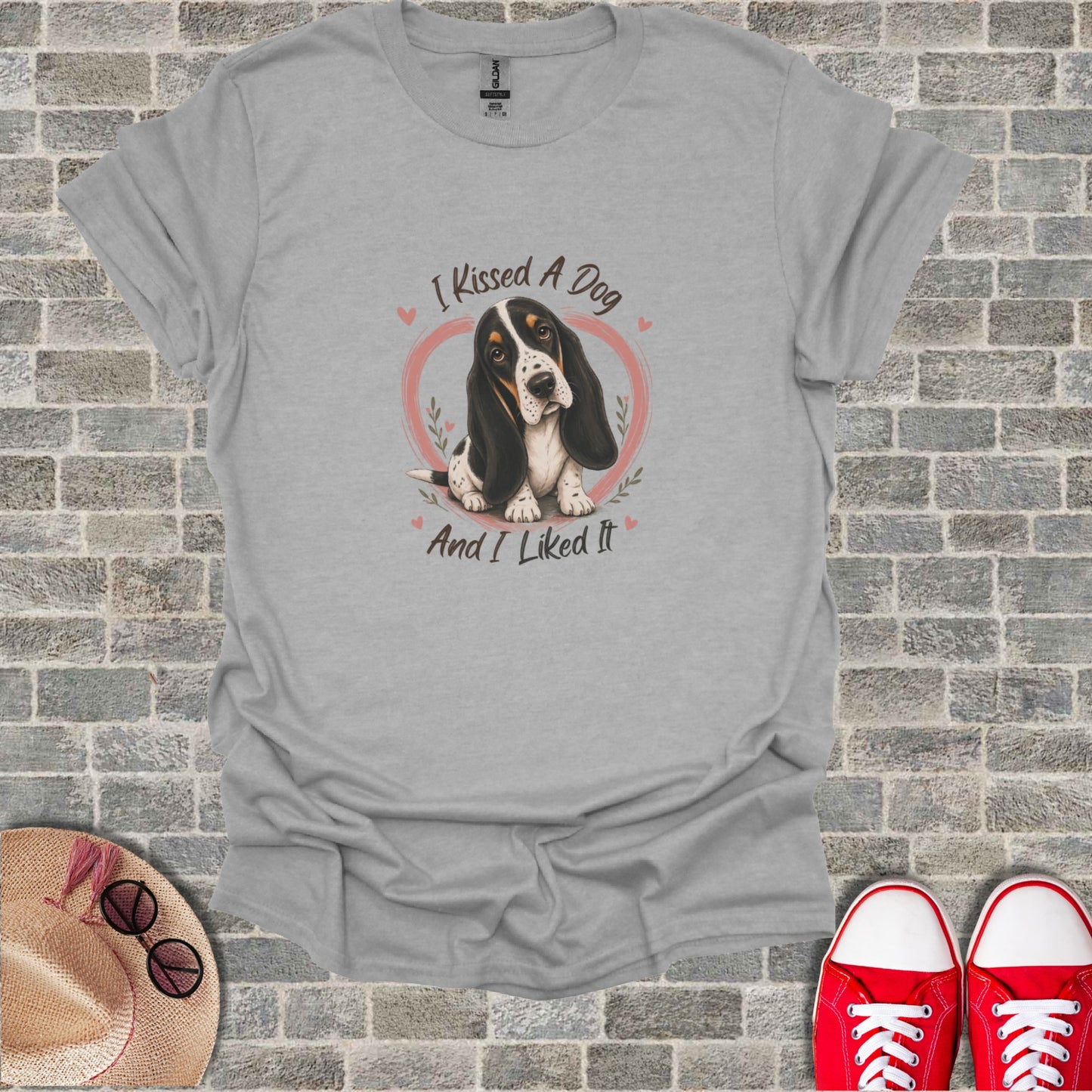 Gray t-shirt with a Basset Hound graphic and the text "I KISSED A DOG AND I LIKED IT".
