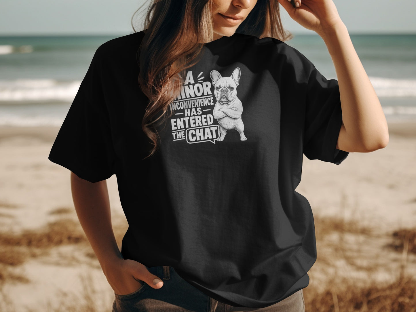 Black t-shirt with a French bulldog illustration and text that reads "A minor inconvenience has entered the chat."
