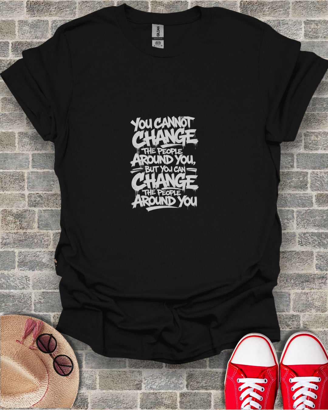 Black t-shirt with "You Cannot Change The People Around You, But You Can Change The People Around You" graphic.