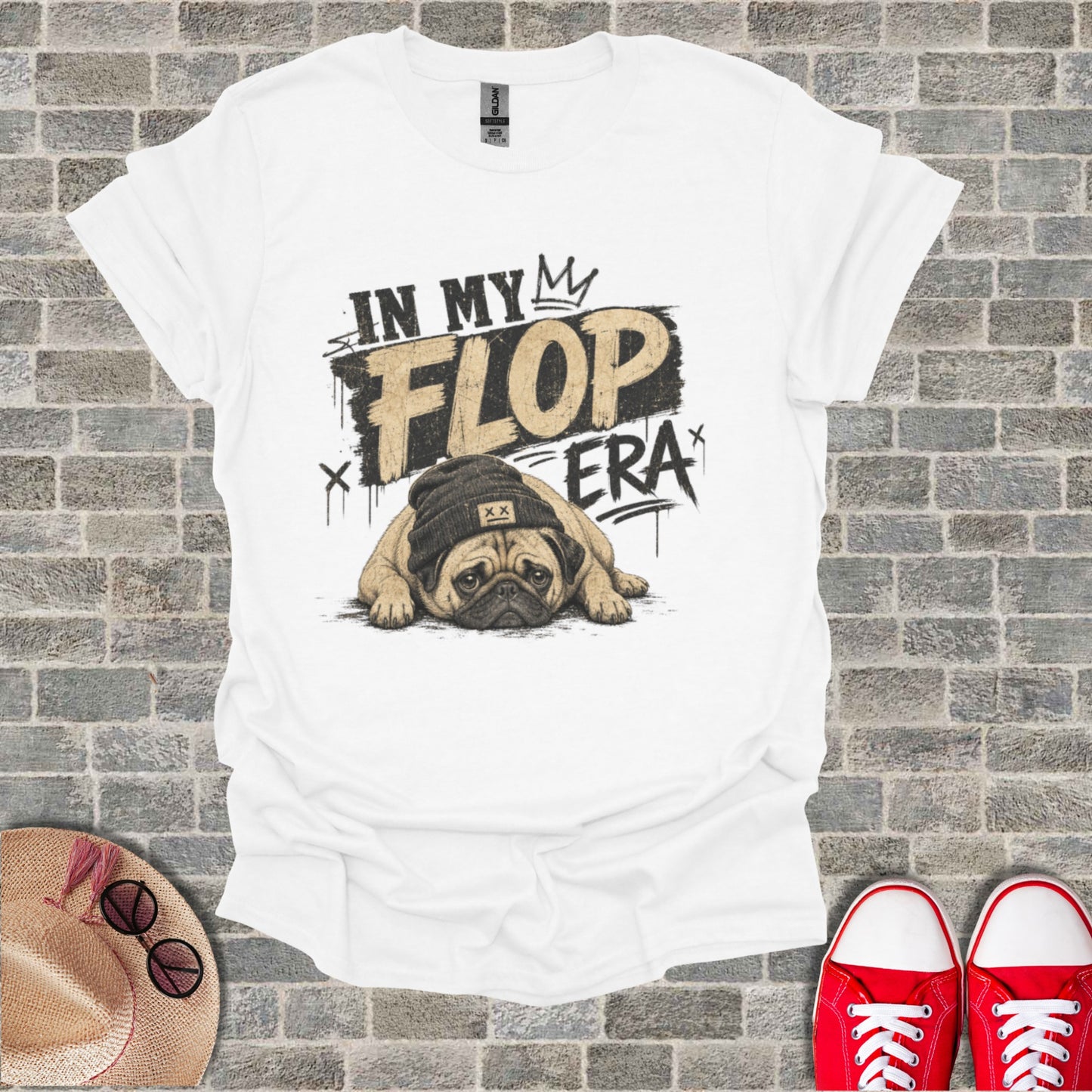 White t-shirt with a pug wearing a beanie and "IN MY FLOP ERA" text.