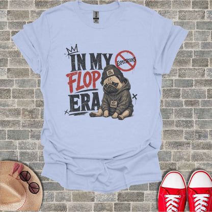Light blue t-shirt with "In My Flop Era" graphic of a pug in a hoodie.