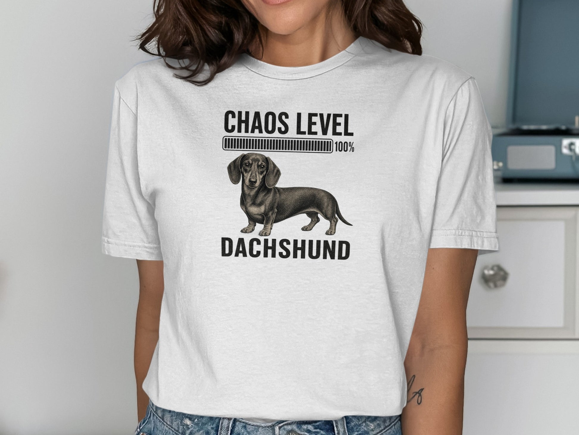 Dachshund t-shirt with "Chaos Level 100%" and progress bar.