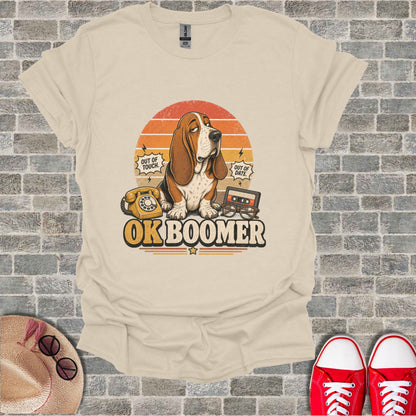 Beige t-shirt featuring a basset hound with "OK BOOMER" text and retro 80s icons.