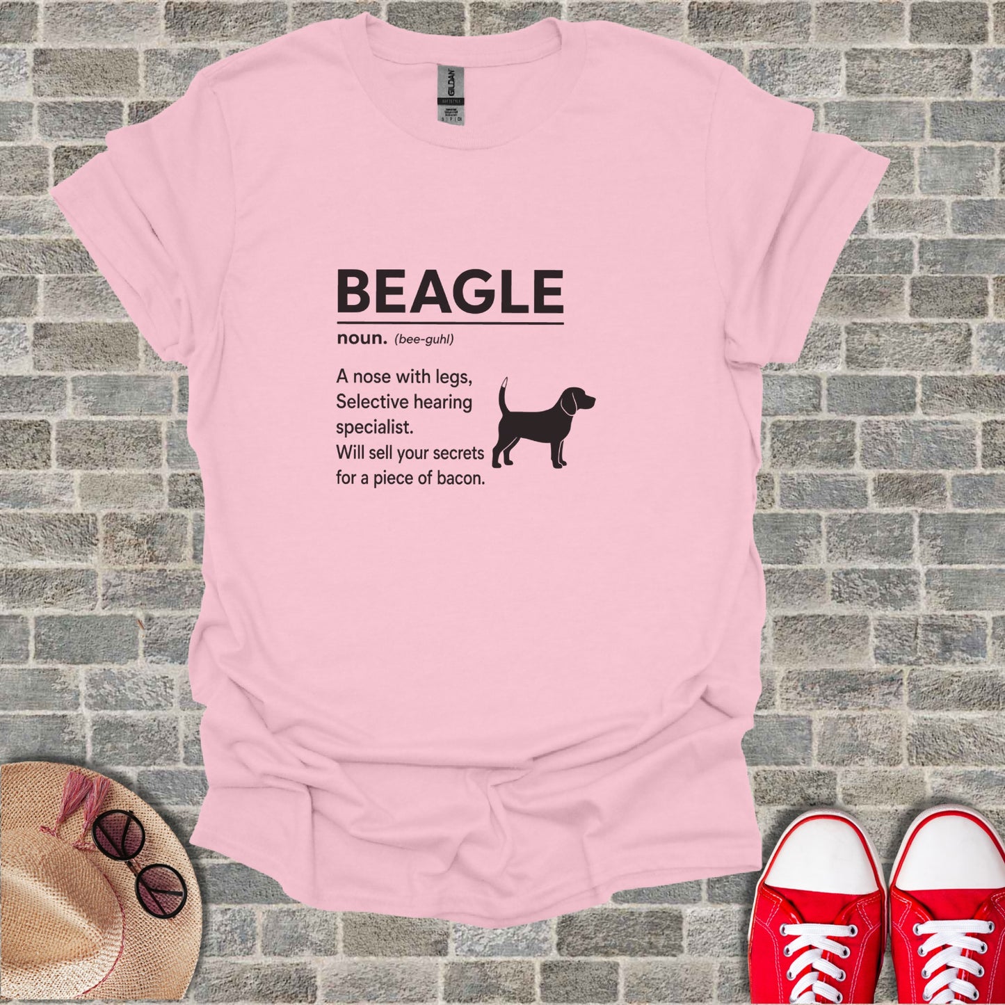 Pink t-shirt with black text "BEAGLE noun. (bee-guhl) A nose with legs, Selective hearing specialist. Will sell your secrets for a piece of bacon."