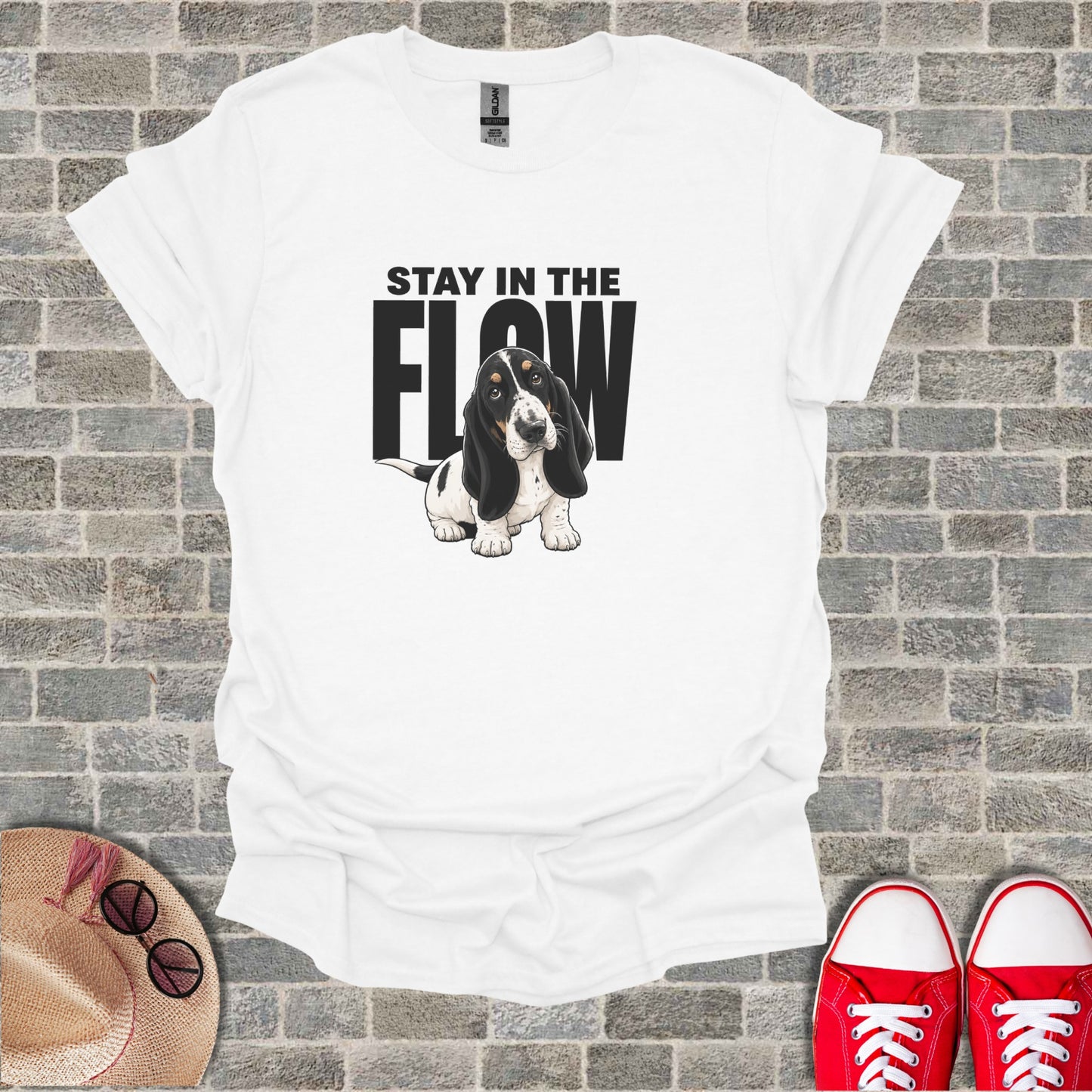 White t-shirt with "STAY IN THE FLOW" and a basset hound graphic.