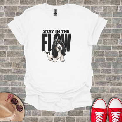 White t-shirt with "STAY IN THE FLOW" and a basset hound graphic.