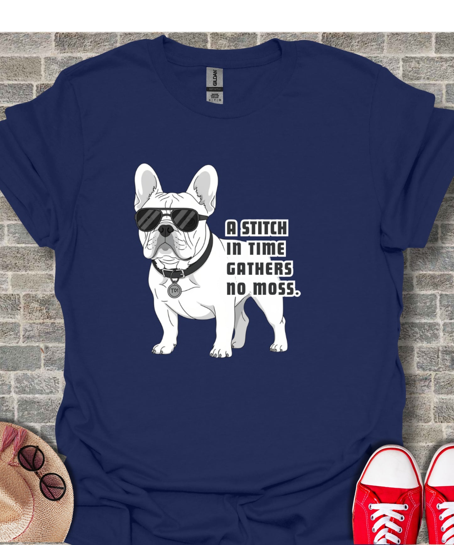 French bulldog wearing sunglasses with text "A stitch in time gathers no moss."
