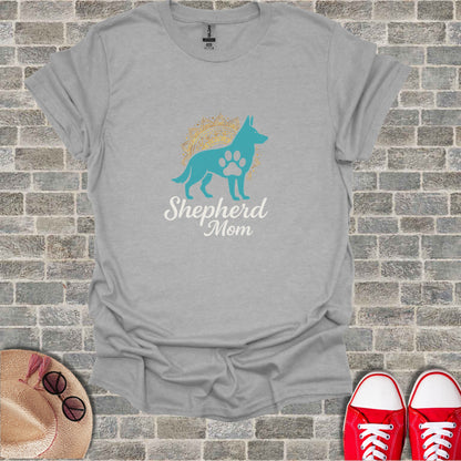Grey t-shirt with "Shepherd Mom" text and dog paw logo.