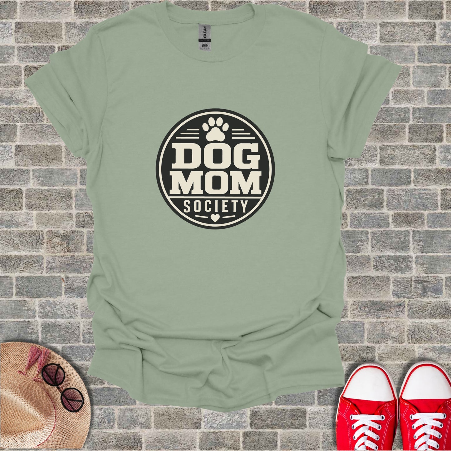 T-shirt with "Dog Mom Society" logo on a light green background.