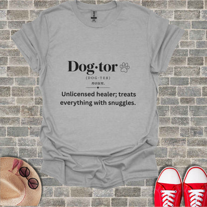 Grey t-shirt with "Dog-tor" definition: Unlicensed healer; treats everything with snuggles.