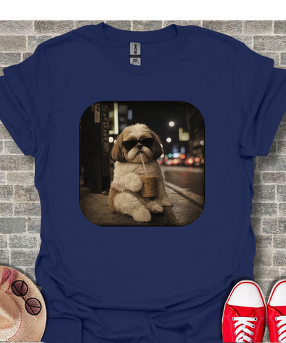 Shih tzu dog with sunglasses drinks iced coffee on a city street at night.