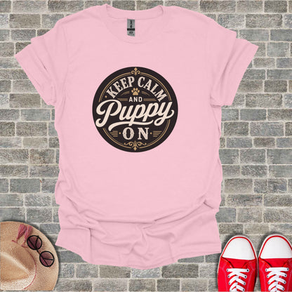Pink t-shirt with "Keep Calm and Puppy On" text and paw print.